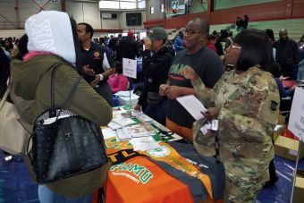 Aerial view of a bustling study hall in a university library with students studying.