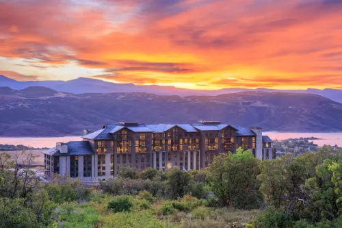 A young man sitting outdoors in Leiden, Netherlands, working on a laptop.